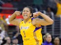 Los Angeles Sparks center Candace Parker, left, celebrates after scoring late in the game as guard Lindsey Harding looks on during the second half in 