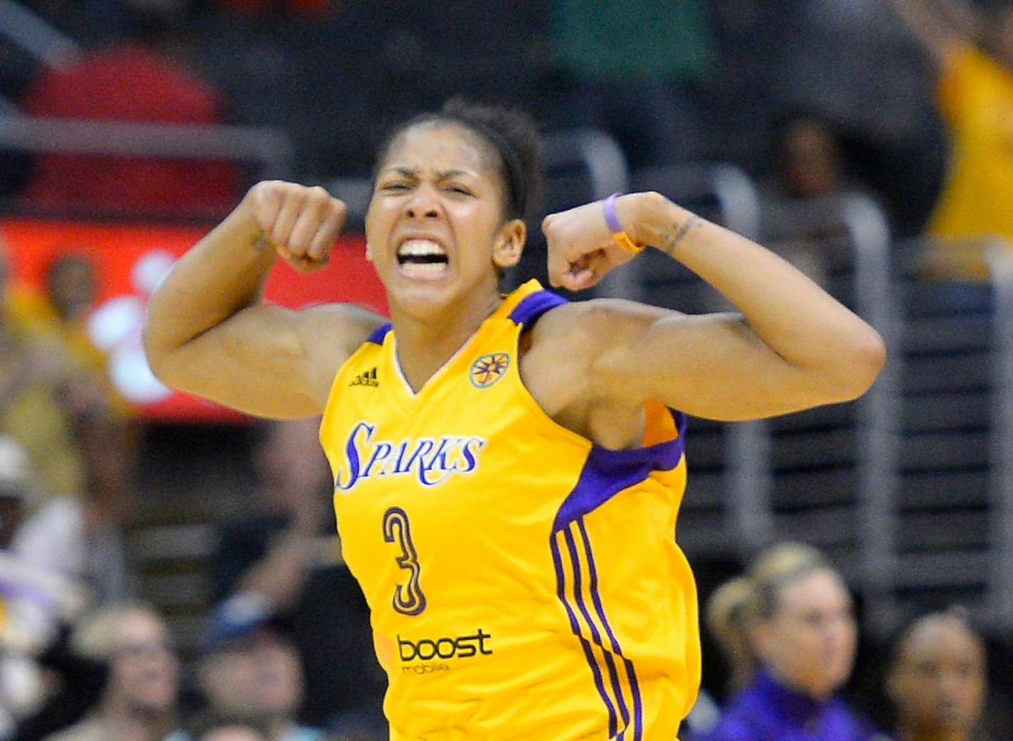 Los Angeles Sparks center Candace Parker, left, celebrates after scoring late in the game as guard Lindsey Harding looks on during the second half in Game 3 of a WNBA basketball Western Conference semifinal series against the Phoenix Mercury, Monday, Sept. 23, 2013, in Los Angeles. The Mercury won 78-77. (AP Photo/Mark J. Terrill)