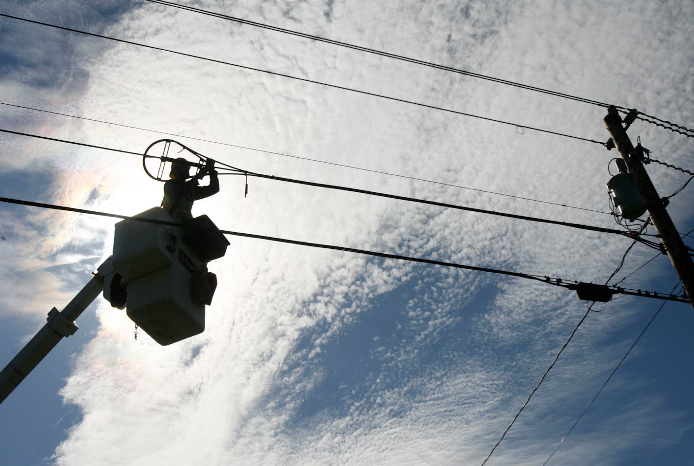 A.J. Bowen of Schupp's Line Construction, Inc. works on fiber-optic installation in Norton, Vt., Tuesday, Oct. 2, 2007. Local and state officials are planning to gather Tuesday to mark the connection of a wireless antenna on top of Town Hall to the fiber-optic Internet pipeline. With $10.5 million in federal grant money secured mainly by Sen. Patrick Leahy, D-Vt., the North-Link project is stringing 375 miles of fiber optic cable in three loops touching Vermont's eight northernmost counties. (AP