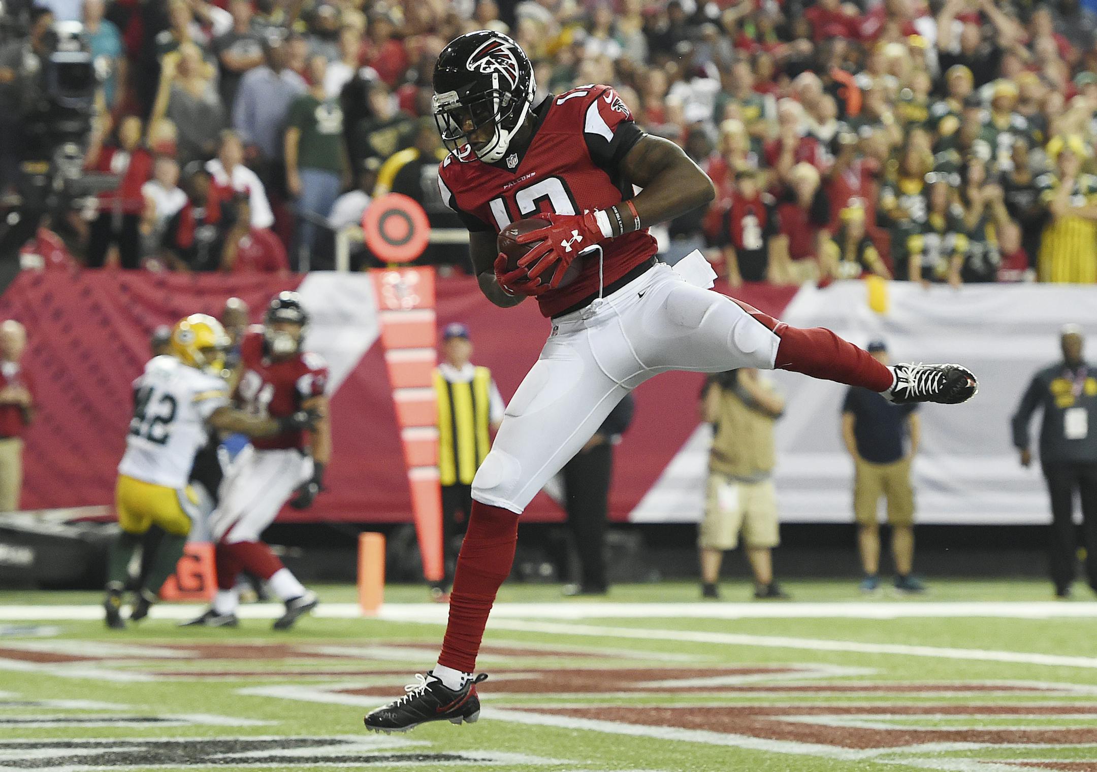 Atlanta Falcons wide receiver Mohamed Sanu (12) makes a touchdown catch against the Green Bay Packers during the second of an NFL football game, Sunday, Oct. 30, 2016, in Atlanta. The Atlanta Falcons won 33-32. (AP Photo/Rainier Ehrhardt) ORG XMIT: GAMS1