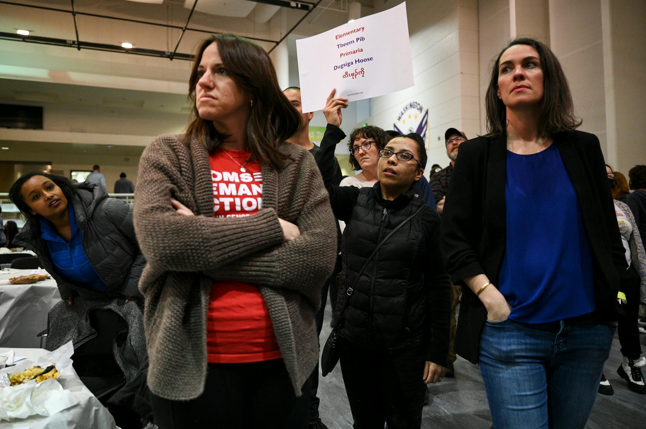 Attendees gathered into groups, including parents of St. Paul public schools, pictured, students, faculty and community members during a public safety event.