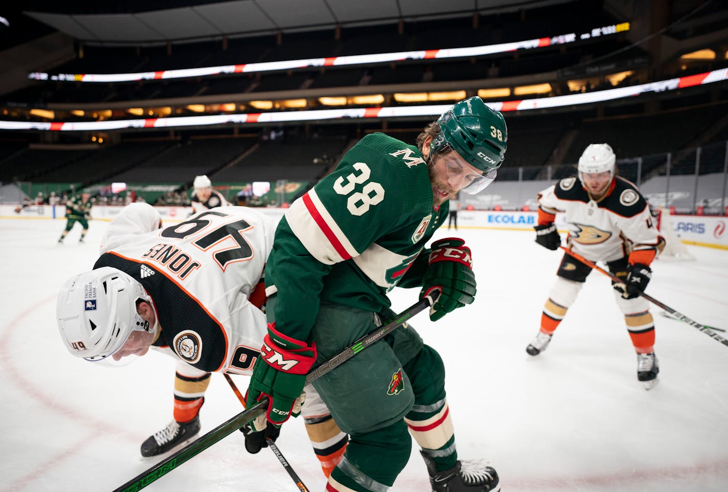 Minnesota Wild right wing Ryan Hartman (38) and Anaheim Ducks left wing Max Jones (49) fought for control of the puck along the boards in the second period. ] JEFF WHEELER • jeff.wheeler@startribune.com