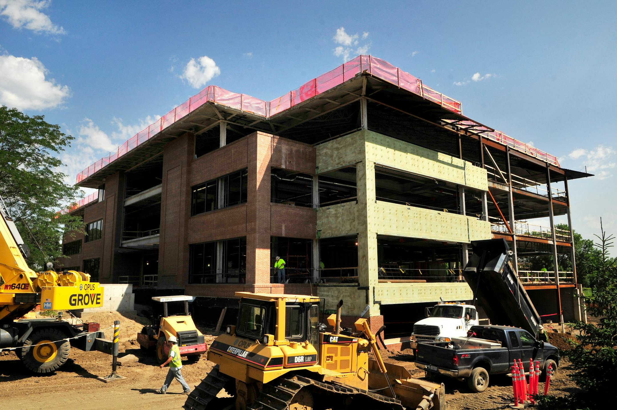 Energy-saving features to qualify for LEED are expected to add 3 to 5 percent to the cost of Opus' expansion project but pay for themselves in about eight years.