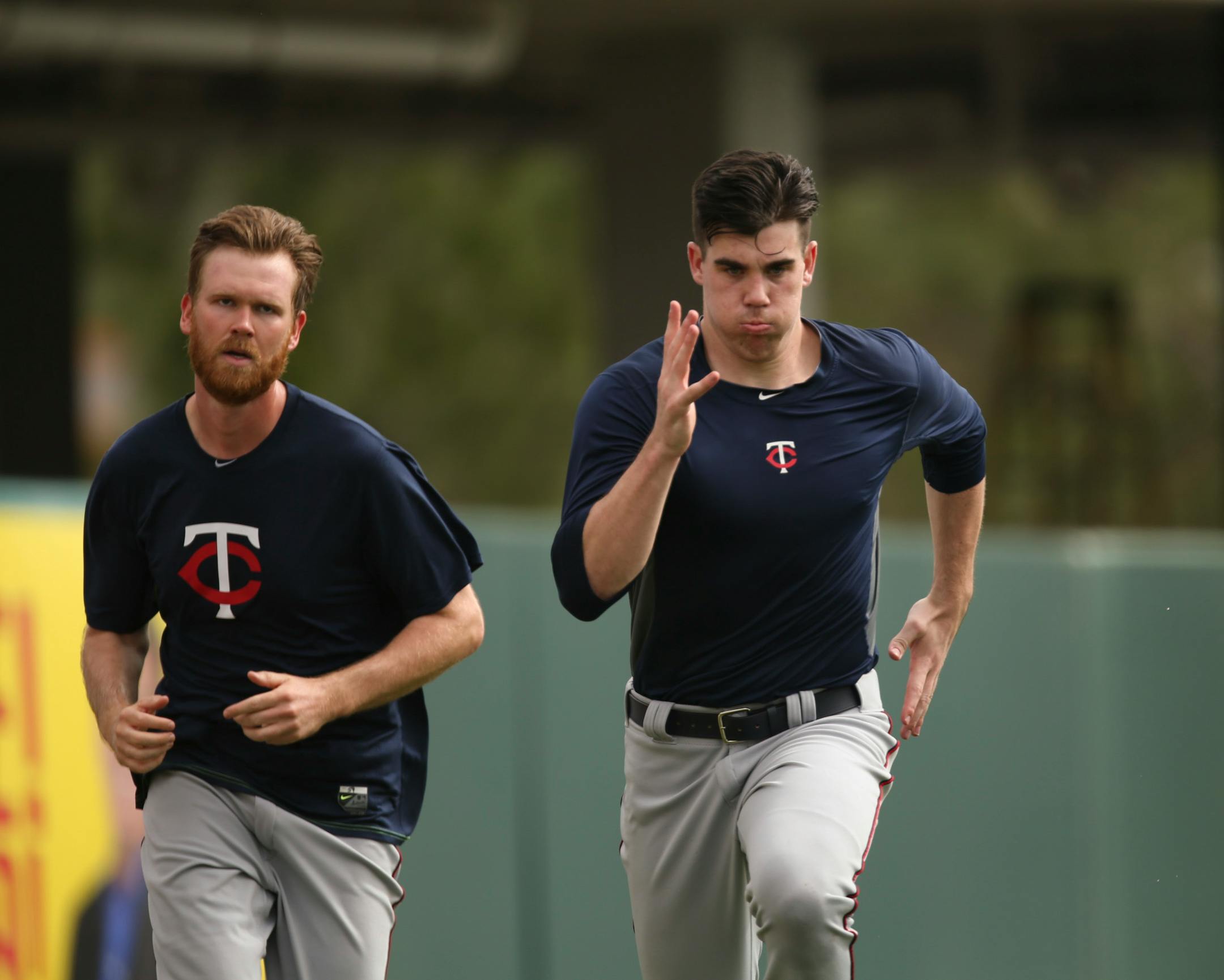 Twins pitcher Trevor May sprinted to the finish while jogging with fellow pitcher Michael Tonkin after their morning workout Wednesday at Hammond Stadium.