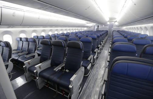 FILE - In this Jan. 26, 2016, file photo, economy class seating is shown on a new United Airlines Boeing 787-9 undergoing final configuration and maintenance work at Seattle-Tacoma International Airport in Seattle. The Federal Aviation Administration would be required to set new minimum requirements for seats on airplanes under legislation to be considered in the House this week. The regulation of seat width and legroom is part of a five-year extension of federal aviation programs agreed to earl