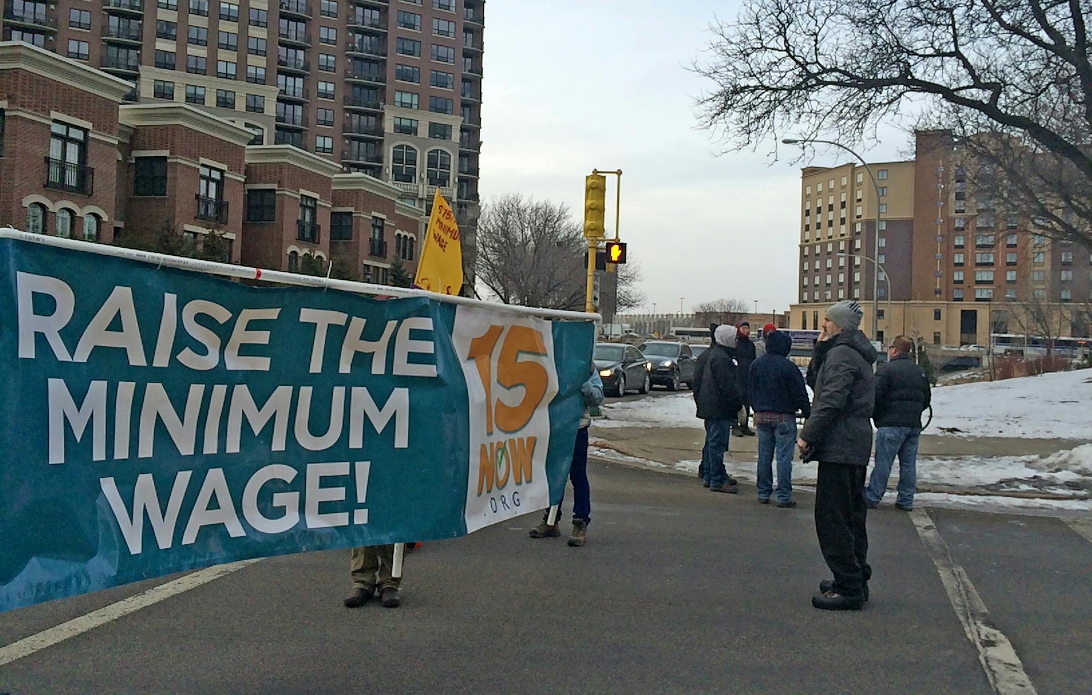 Protesters supporting a $15 minimum wage blocked I-35 traffic from entering downtown Thursday morning.