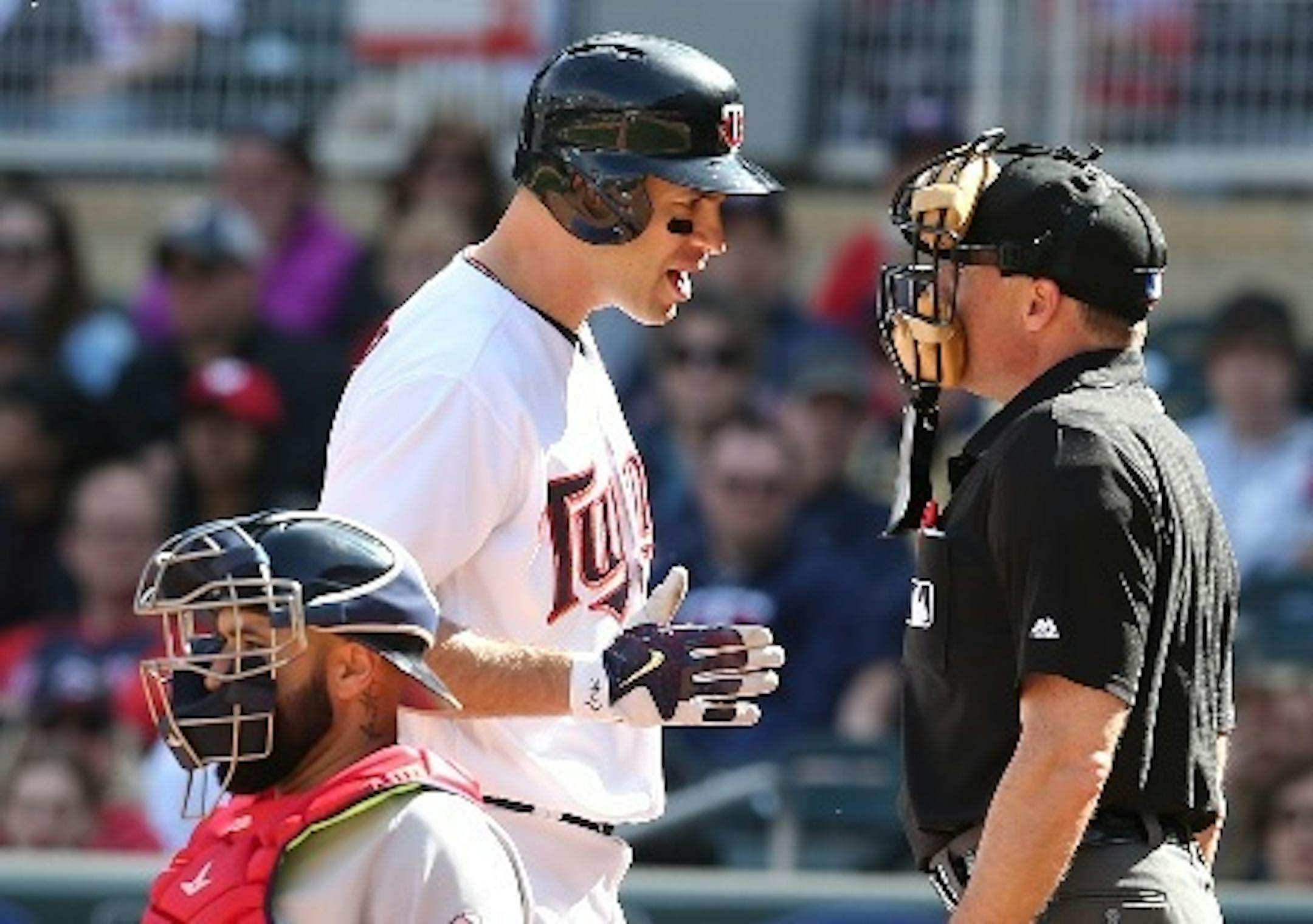Twins pinch hitter Joe Mauer protested a called third strike by umpire Dan Iassogna in the eight inning against the Boston Red Sox on Sunday.