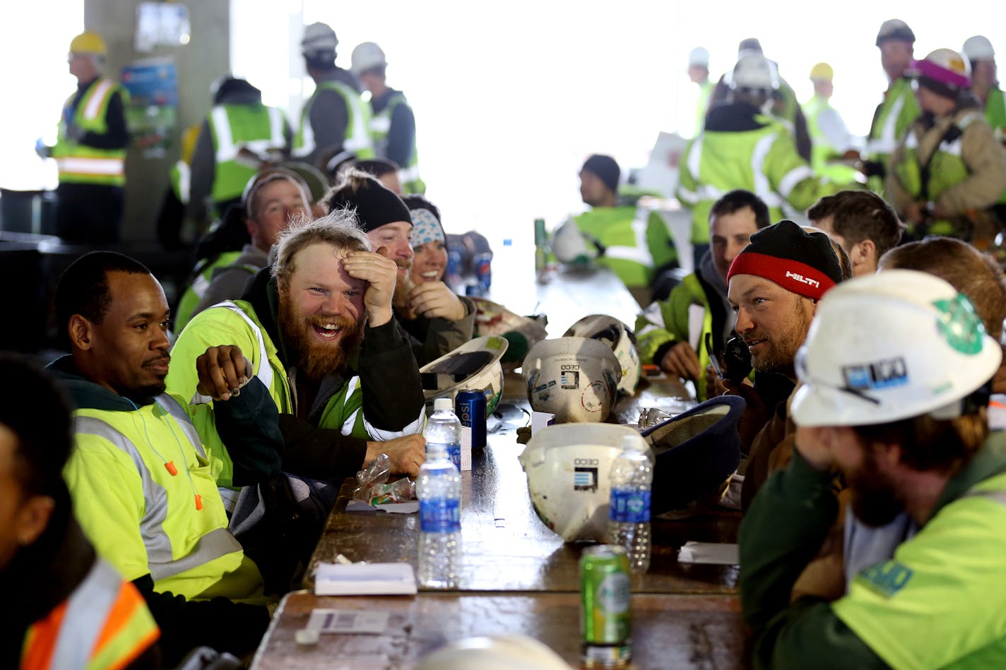 Construction workers enjoy a free lunch provided by the Vikings organization at Vikings stadium on Friday, December 12, 2014. ] LEILA NAVIDI leila.navidi@startribune.com /