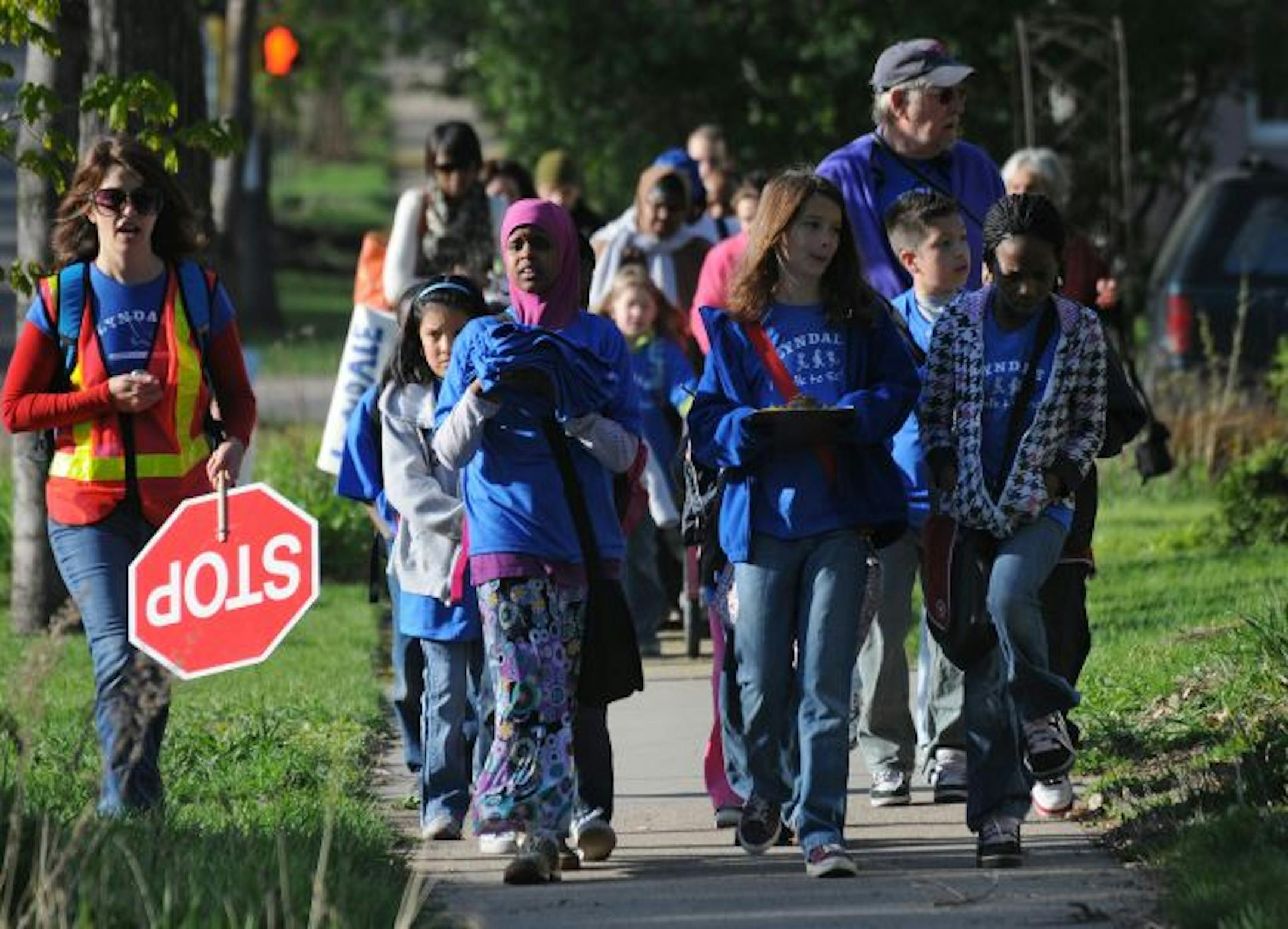 Parents at Lyndale Community School have organized a caravan of kids and parents to encourage kids to walk to school. At left is parent Jenny Borden.