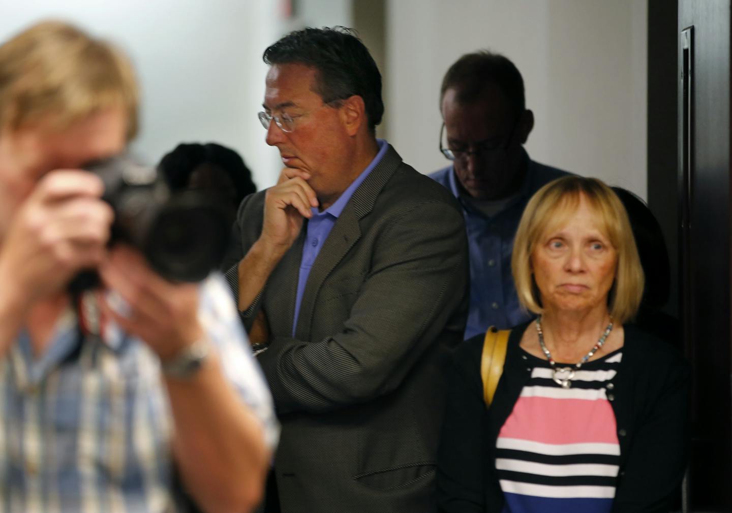 Vikings executive vice president Lester Bagley, center, attends a news conference addressing the fatal fall at the Vikings stadium Wednesday, Aug. 26, 2015.