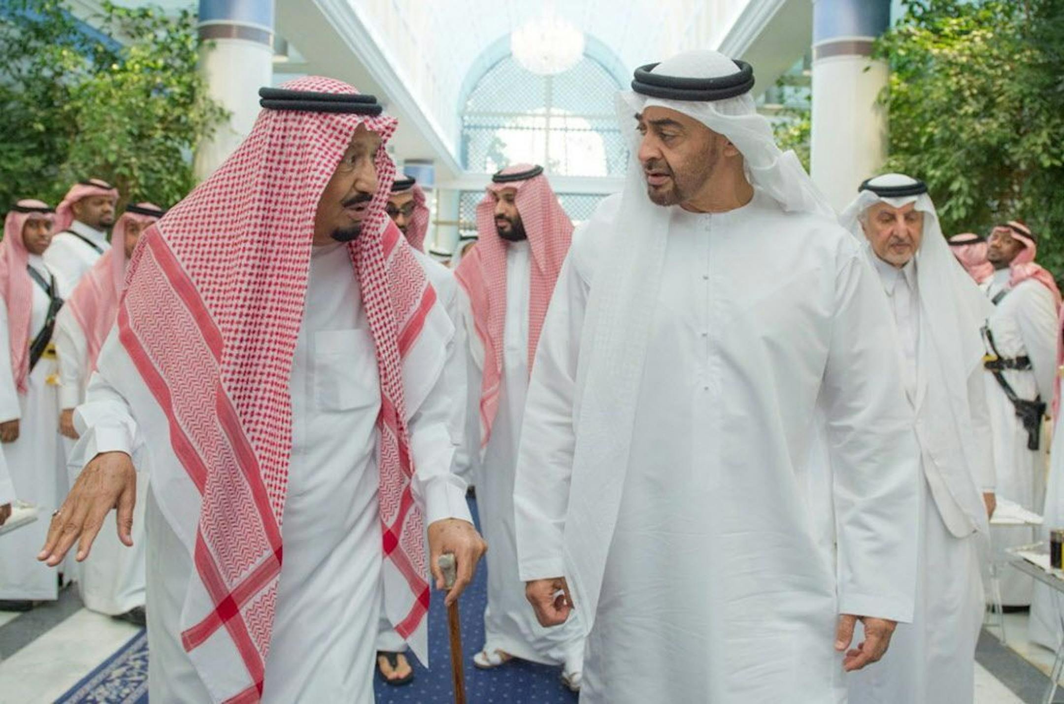 In this Friday, June 2, 2017 photo released by Saudi Press Agency, SPA, Saudi King Salman bin Abdulaziz Al Saud, left, talks to Sheikh Mohammed bin Zayed Al Nahyan, Abu Dhabi's Crown Prince in Jiddah, Saudi Arabia. Four Arab nations cut diplomatic ties to Qatar early Monday morning, June 5, further deepening a rift among Gulf Arab nations over that country's support for Islamist groups and its relations with Iran.