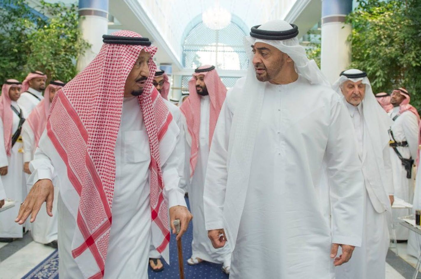 In this Friday, June 2, 2017 photo released by Saudi Press Agency, SPA, Saudi King Salman bin Abdulaziz Al Saud, left, talks to Sheikh Mohammed bin Zayed Al Nahyan, Abu Dhabi's Crown Prince in Jiddah, Saudi Arabia. Four Arab nations cut diplomatic ties to Qatar early Monday morning, June 5, further deepening a rift among Gulf Arab nations over that country's support for Islamist groups and its relations with Iran.