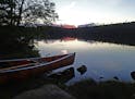 As the sun set over Moon Lake in the BWCA, the last canoe was ready to be portaged over a hilly trail leading to East Bearskin Lake, which lies partia