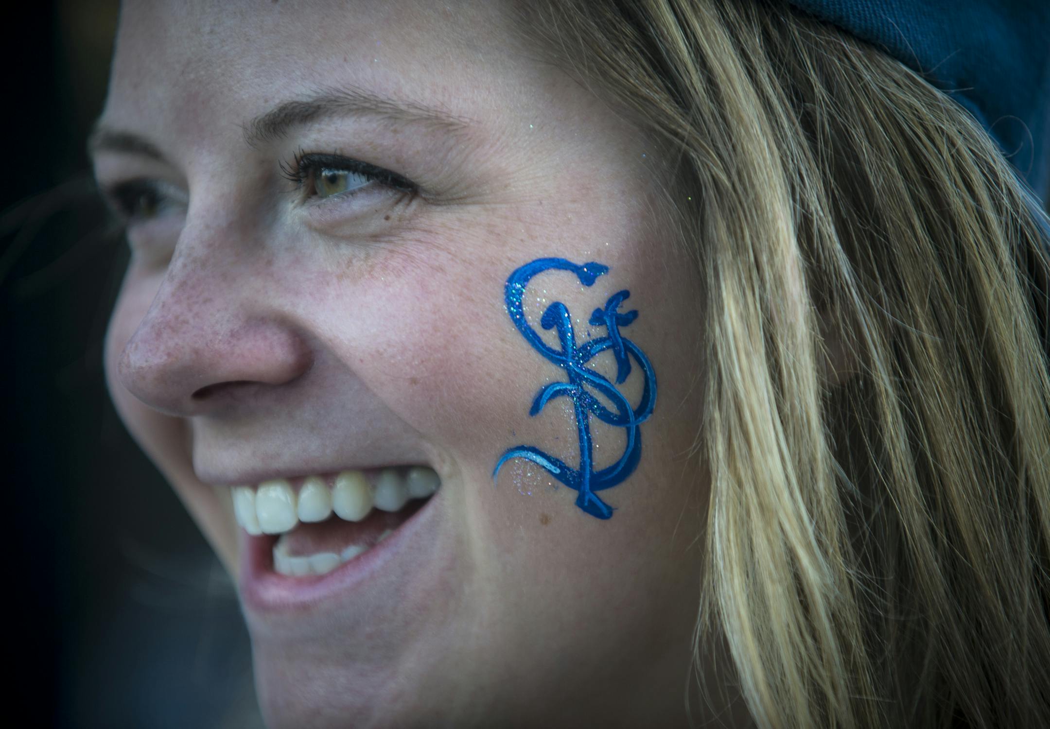 Maggie Whelan, of Minneapolis, painted her face with the St. Paul Saints logo before Thursday night's home opener. ] Aaron Lavinsky &#x2022; aaron.lavinsky@startribune.com The St. Paul Saints hold their season opener against the Fargo-Moorhead Redhawks at brand-new CHS Field on Thursday, May 21, 2015.