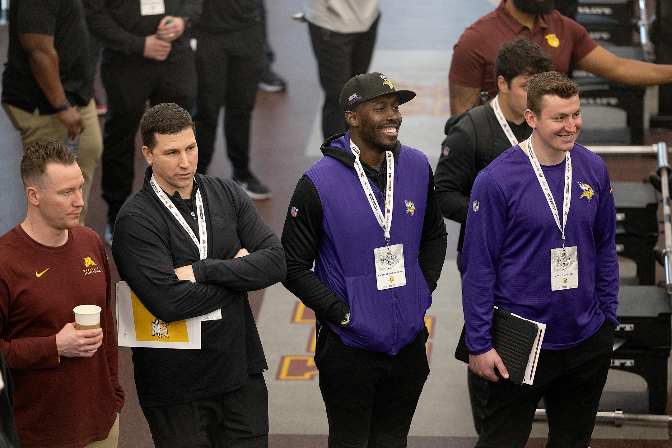 Kwesi Adofo-Mensah, general manager of the Minnesota Vikings, second from right, watches as players bench press 225 pounds during the Minnesota Pro Day.