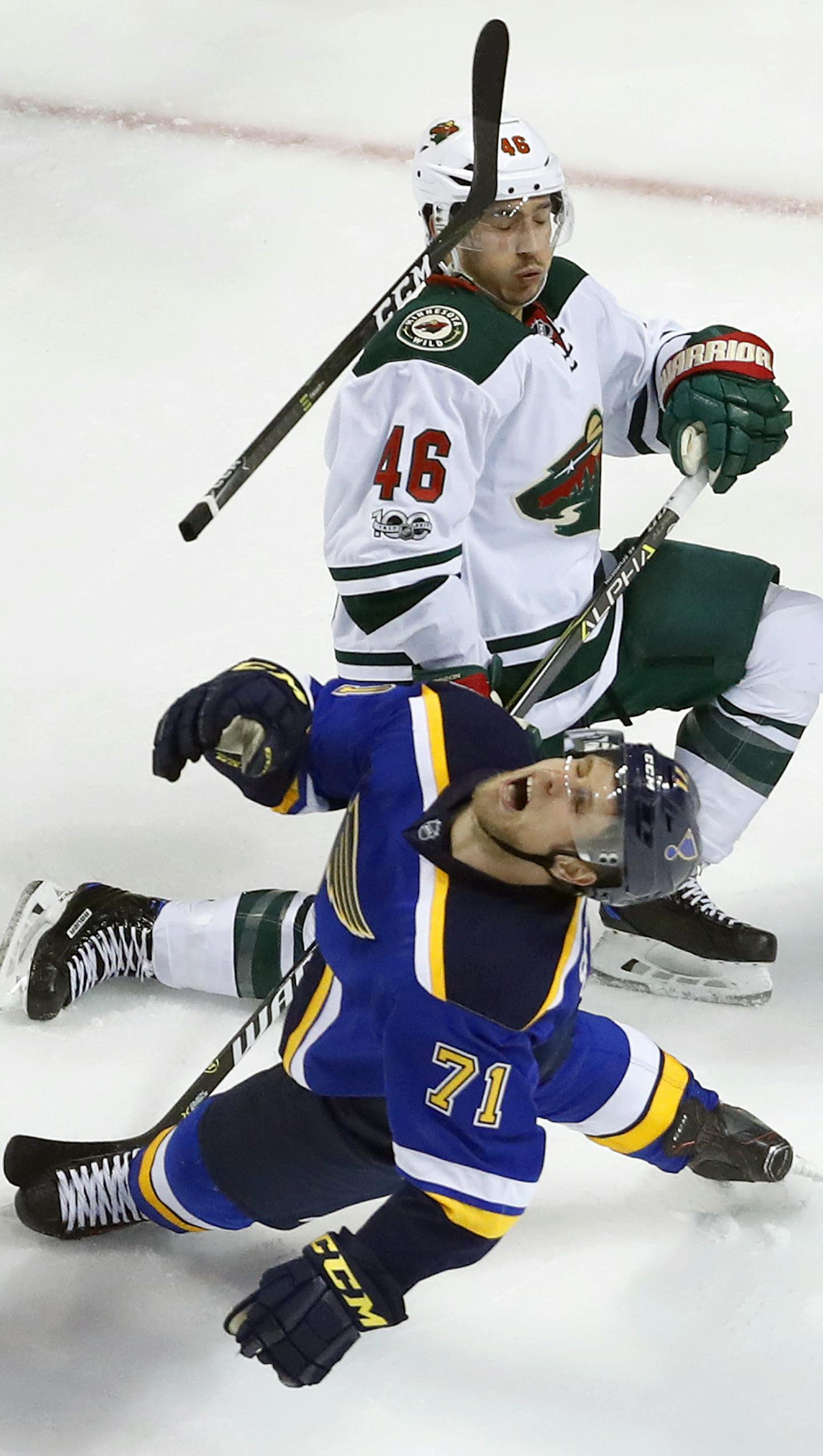 St. Louis Blues' Vladimir Sobotka, of the Czech Republic, loses his stick after colliding with Minnesota Wild's Jared Spurgeon (46) during the third period in Game 4 of an NHL hockey first-round playoff series Wednesday, April 19, 2017, in St. Louis. The Wild won 2-0. (AP Photo/Jeff Roberson)