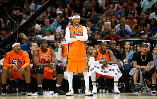 3's Company player/captain and coach Allen Iverson, center, watches from the sideline during the first half of a BIG3 game in 2017.