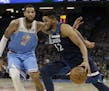 Minnesota Timberwolves center Karl-Anthony Towns, right, drives against Sacramento Kings center Willie Cauley-Stein during the second quarter of an NB