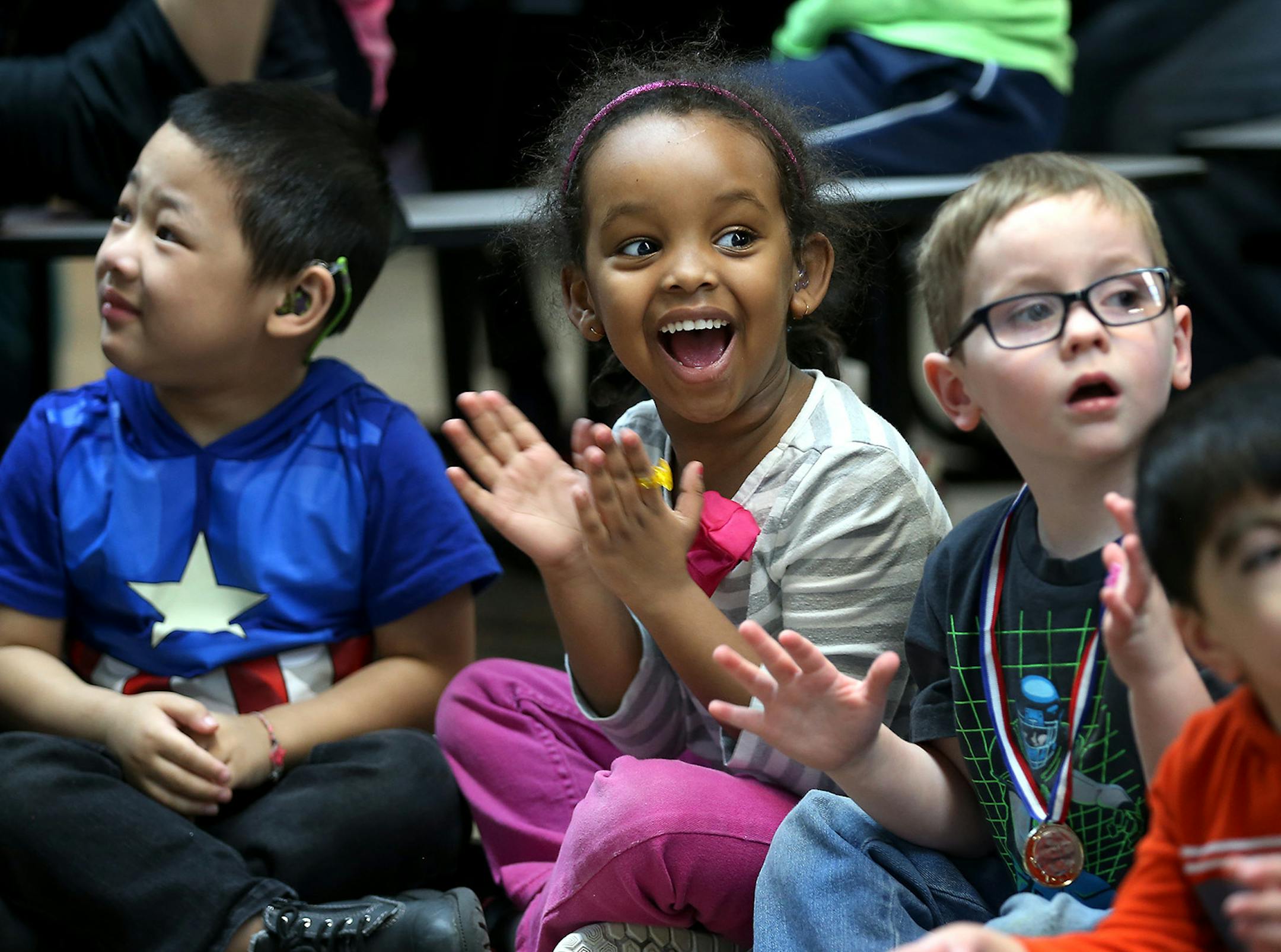 Suraiya Abas, second from right, was among those excited to see Wolves guard Zach LaVine, who funded a kitchen remodeling.