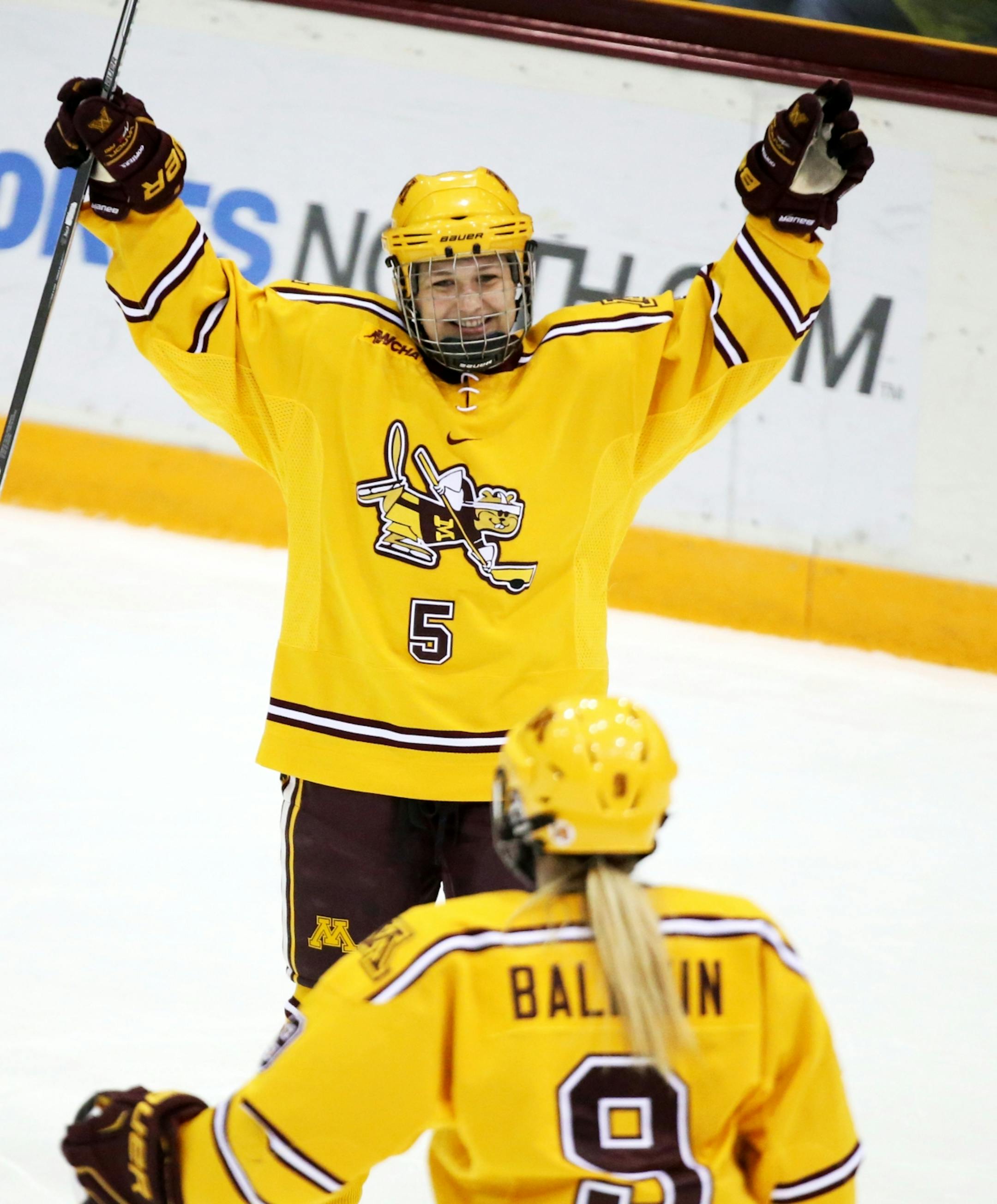 University of Minnesota left wing Sopie Skarzynski (5) celebrates her goal with teammate Sydney Baldwin (9) during the third period of the Gophers 3-0 win over the University of North Dakota Friday, Feb. 5, 2016, at Ridder Arena on the campus of the University of Minnesota in Minneapolis, MN.