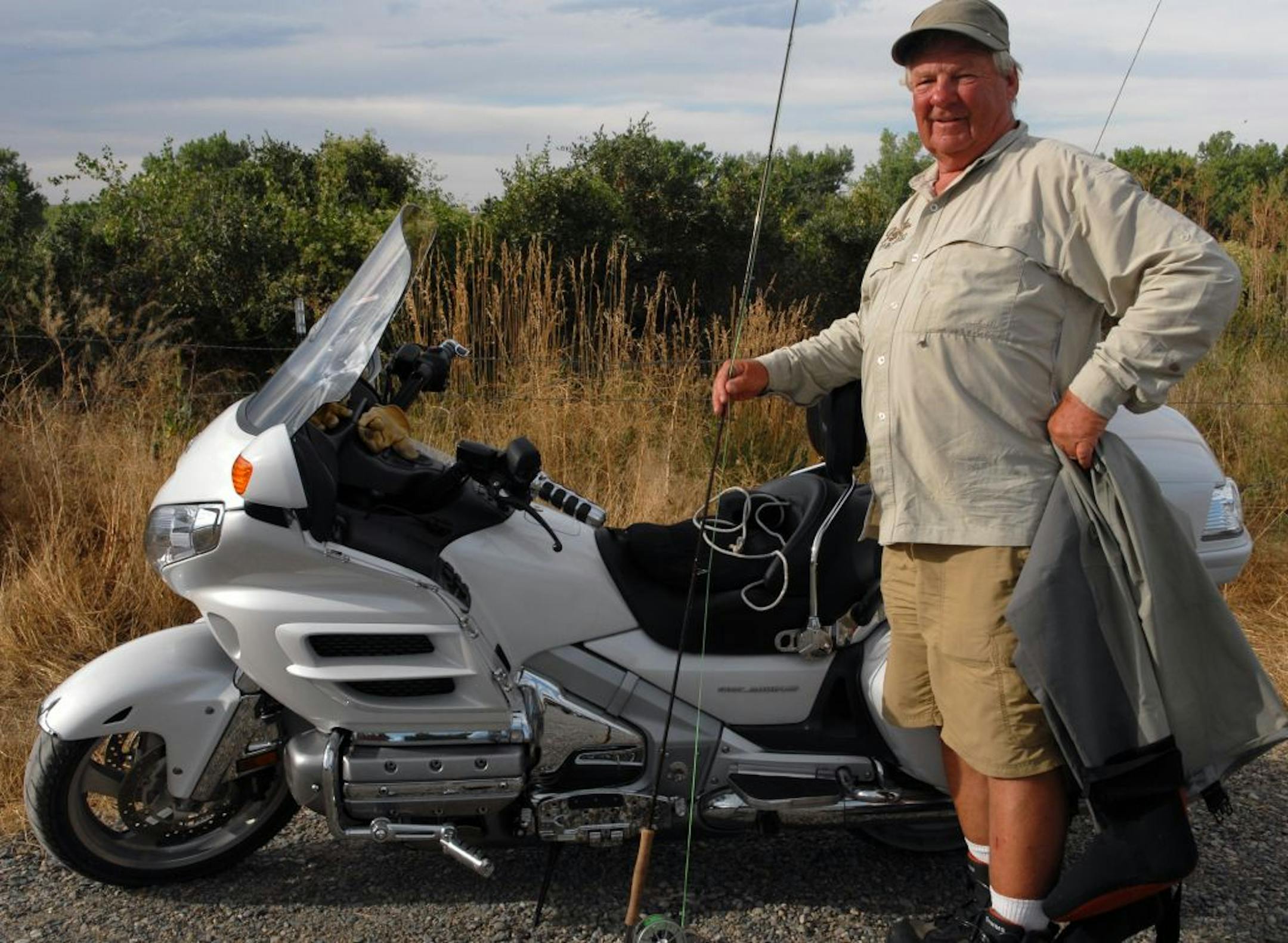 David Rovick of the Twin Cities traveled more than 5,000 miles on his motorcycle in the past month to fish waters as far west as Oregon's Deschutes River. Here he and his Honda touring bike are pictured near the banks of the Bighorn River in Montana.