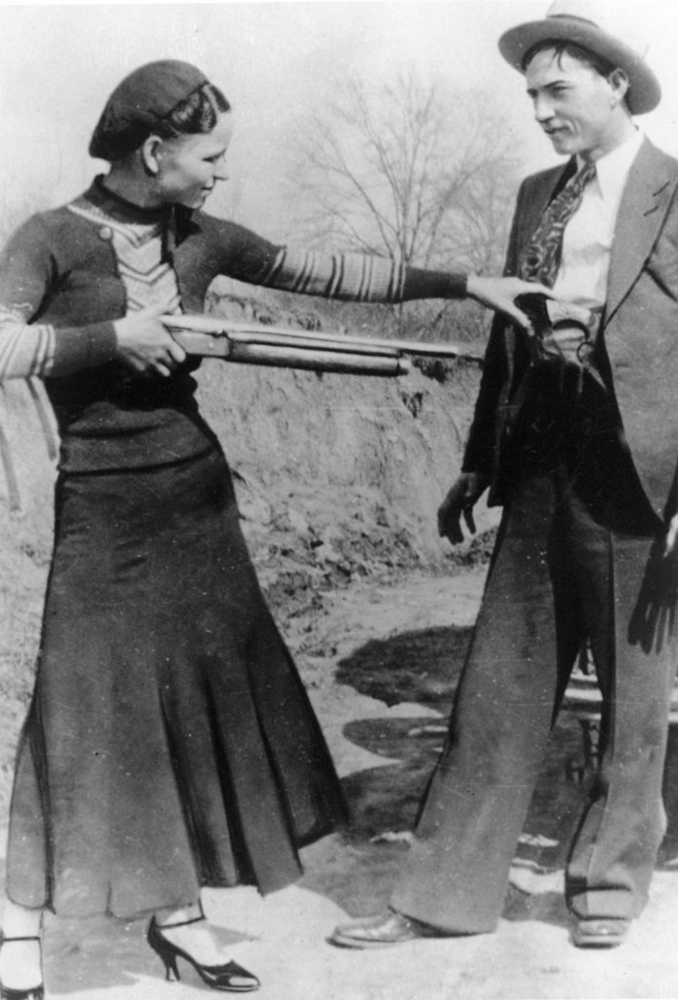 FILE - This this undated file photo shows outlaws and lovers Bonnie Parker, left, and Clyde Barrow. Guns and other items connected to the couple are going on auction by RR Auction of Amherst, N.H. An auction official estimated Thursday, July 12, 2012, that the handguns found on the duo after they were shot dead each could fetch between $100,000 and $200,000.