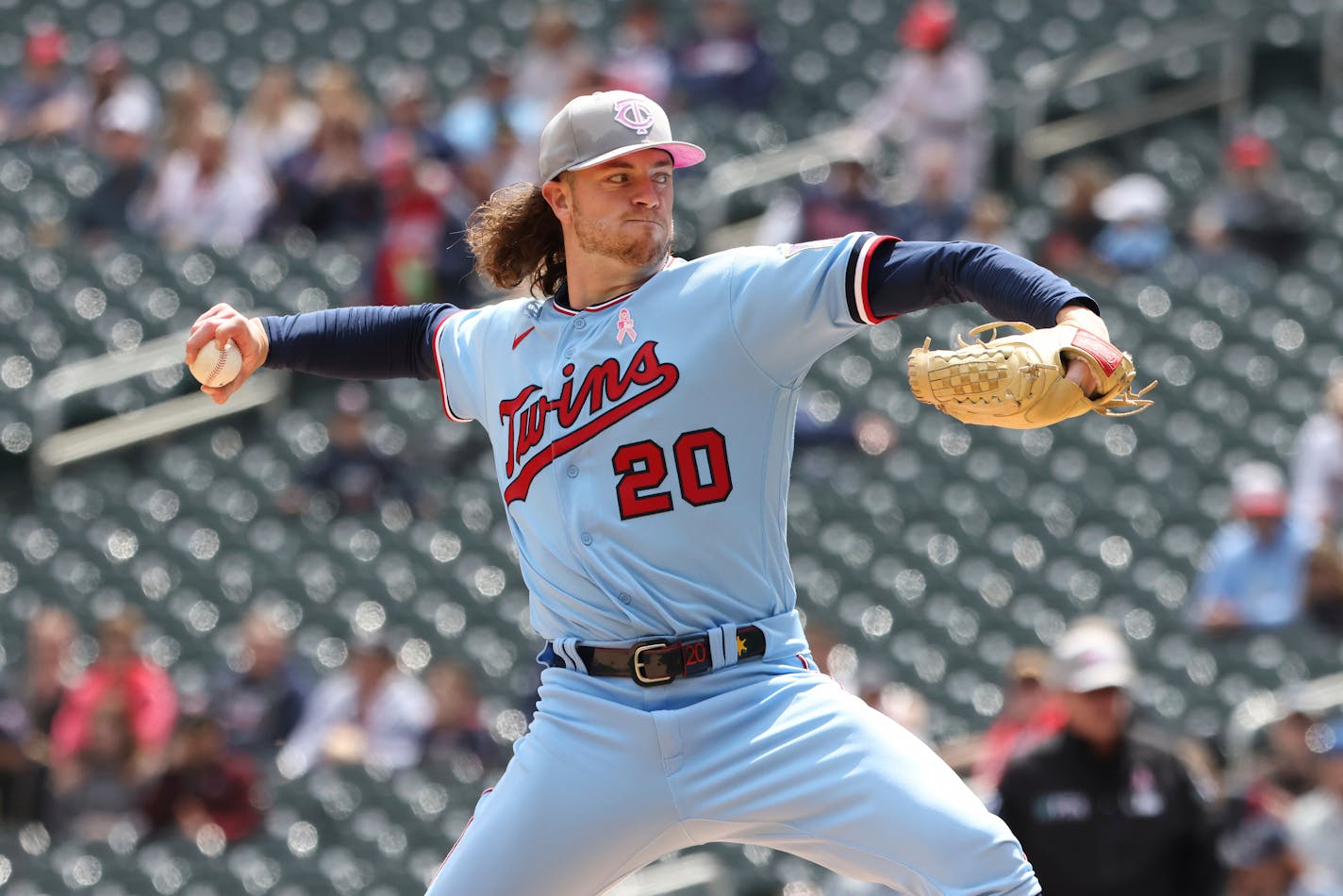 Minnesota Twins starting pitcher Chris Paddack (20) throws against the Oakland Athletics during the first inning of a baseball game, Sunday, May 8, 2022, in Minneapolis. (AP Photo/Stacy Bengs)