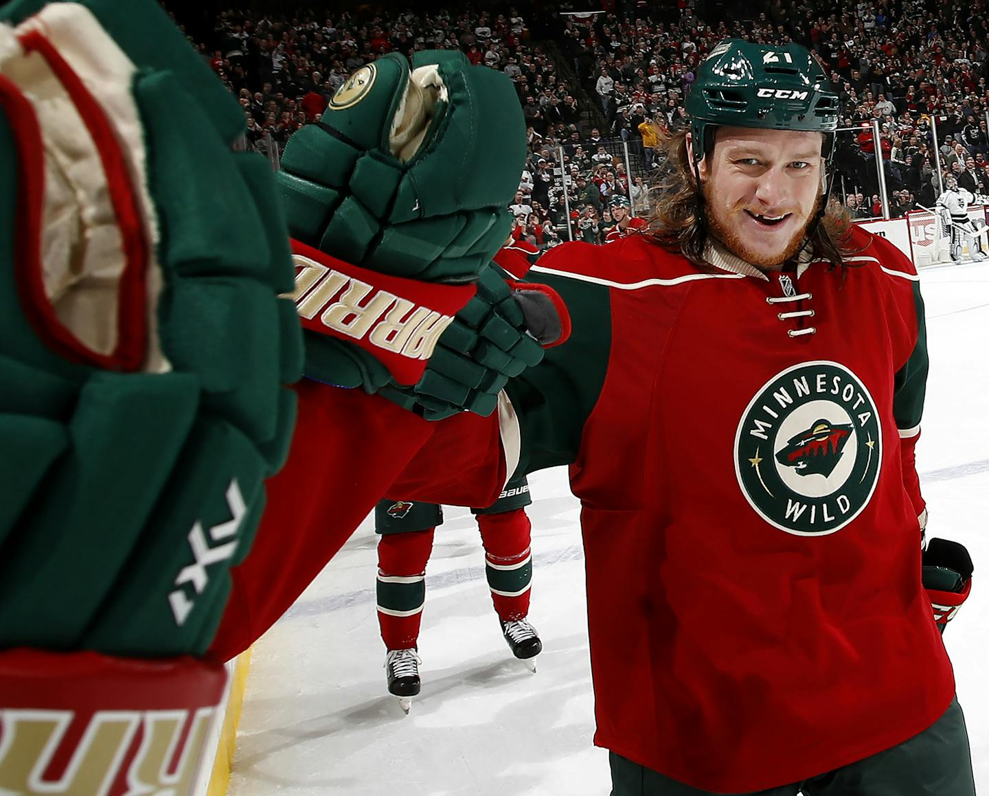 Newly acquired Wild forward Ryan White was congratulated by teammates after scoring his first goal with his new team in the second period Monday, tying the score 3-3.