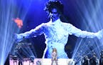 Madonna performs a tribute to Prince, pictured onscreen, at the Billboard Music Awards at the T-Mobile Arena on Sunday, May 22, 2016, in Las Vegas. (P