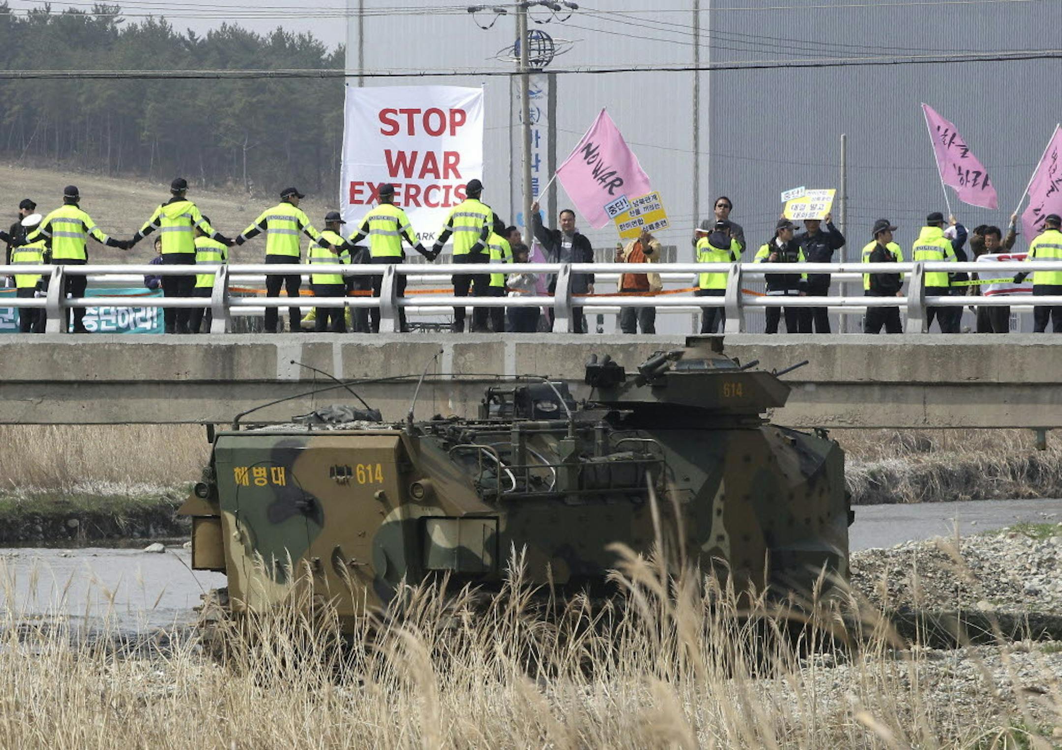 March 31, 2014: Anti-war protesters stage a rally during the U.S.-South Korea joint landing exercises called Ssangyong as part of the Foal Eagle military exercises in Pohang, South Korea.