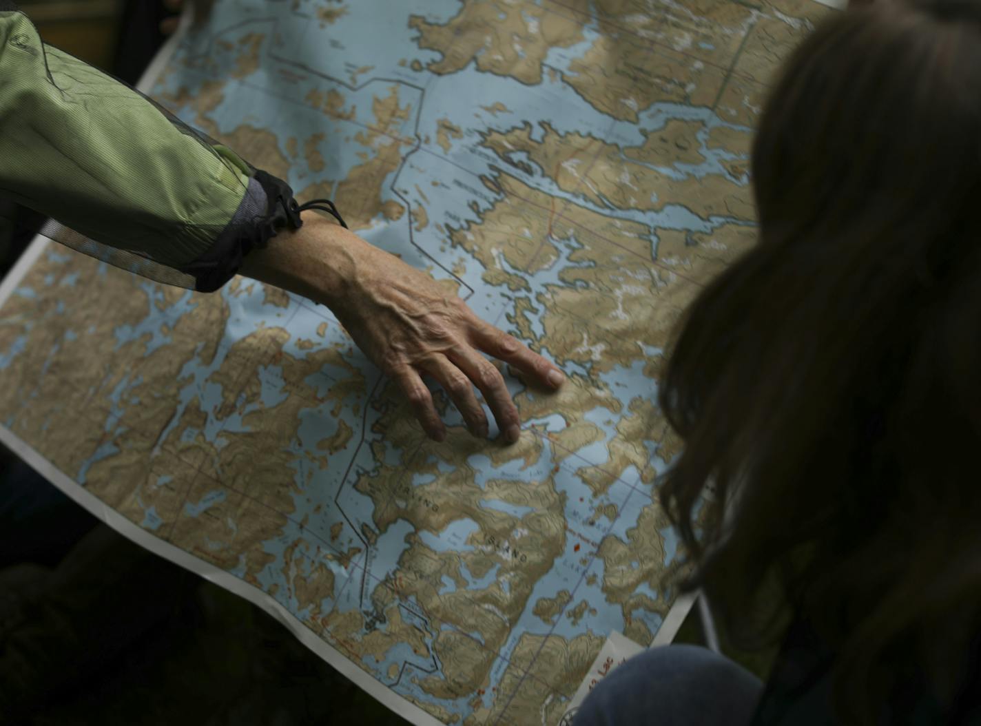 Jane Stark showed Mary Benson on a map where they will begin their trip in Canada's Quetico Provincial Park. ] JEFF WHEELER &#xef; jeff.wheeler@startribune.com Six women who have known each other for years through their book club are going to try a canoe trip together in Canada's Quetico Provincial Park next month. Wednesday evening, May 24, 2017 they gathered at the home of one of their members, Pat Aubrecht, for a portrait. They all have camping experience, but only Allar has been canoe campin