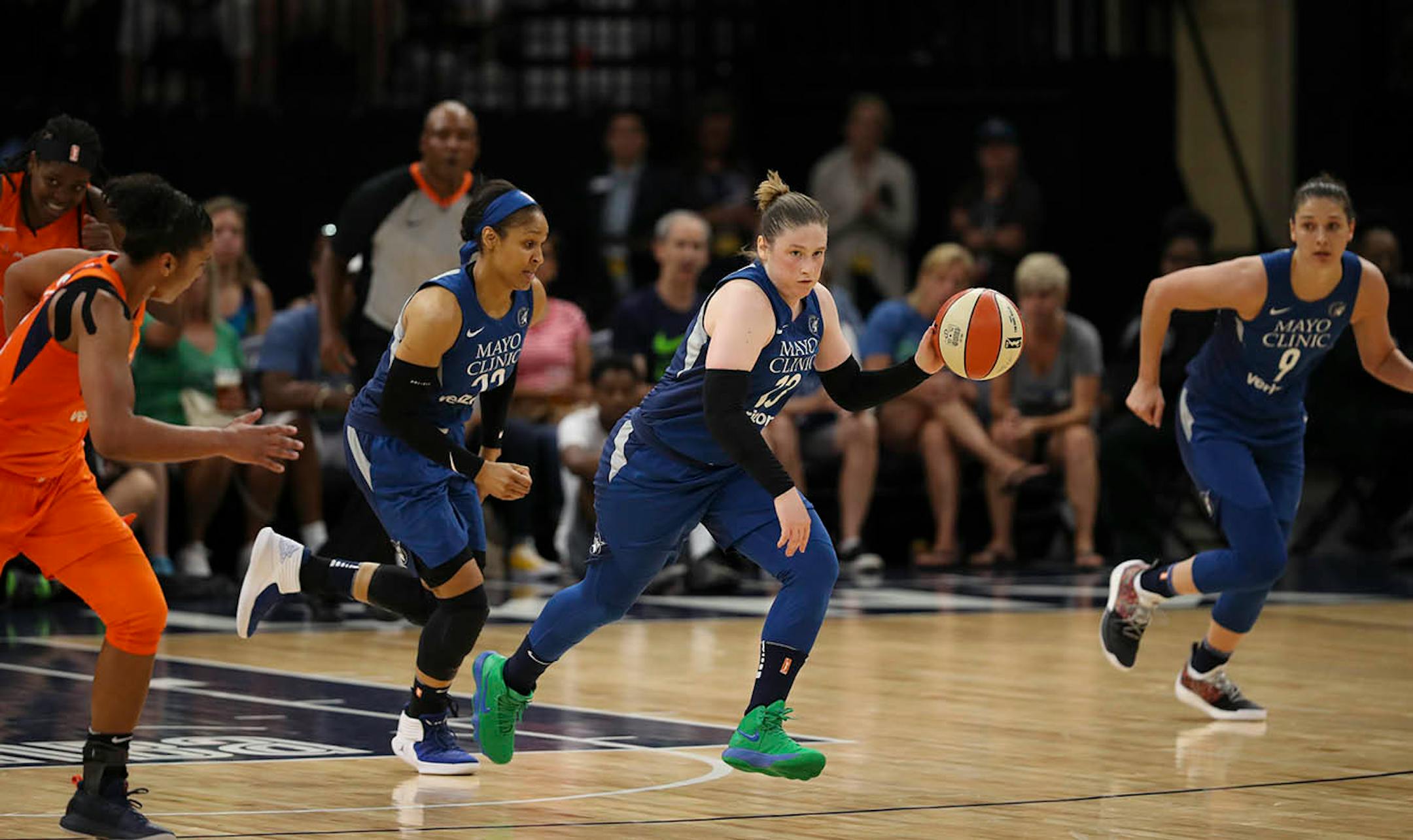 Minnesota Lynx guard Lindsay Whalen (13) headed upcourt after stealing a Sun pass in the first half.
