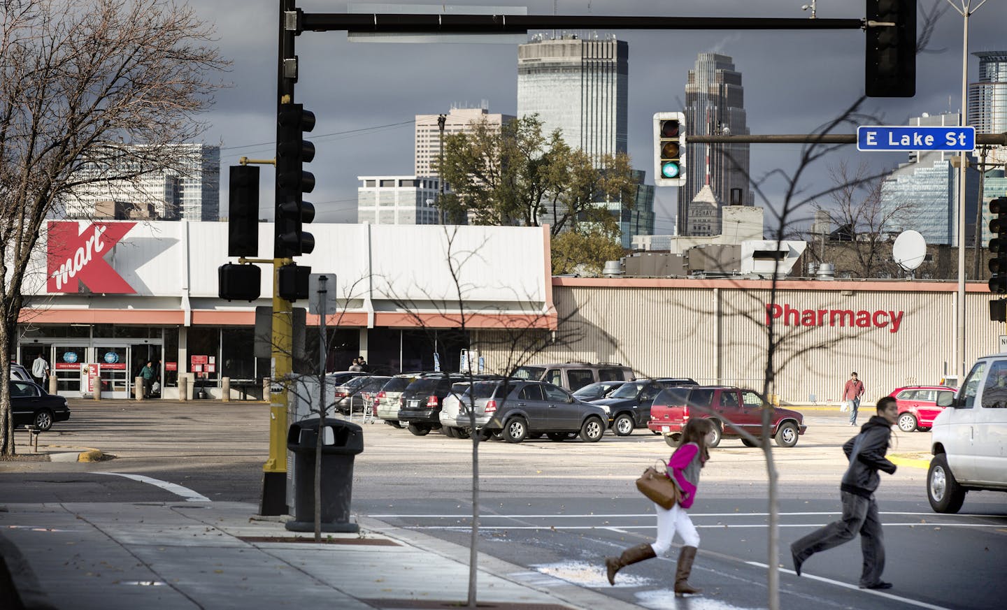 Pedestrians cross the street near the Kmart on Lake Street and Nicollet Avenue Minneapolis on Thursday, November 5, 2015. ] (LEILA NAVIDI/STAR TRIBUNE) leila.navidi@startribune.com BACKGROUND INFORMATION: The city will announce Thursday that they are poised to buy two parcels of land that comprise the so-called "Kmart site" on Lake Street. The announcement comes more than 15 years after the city began seriously talking about reopening the corridor, a process that has been bogged down by complica