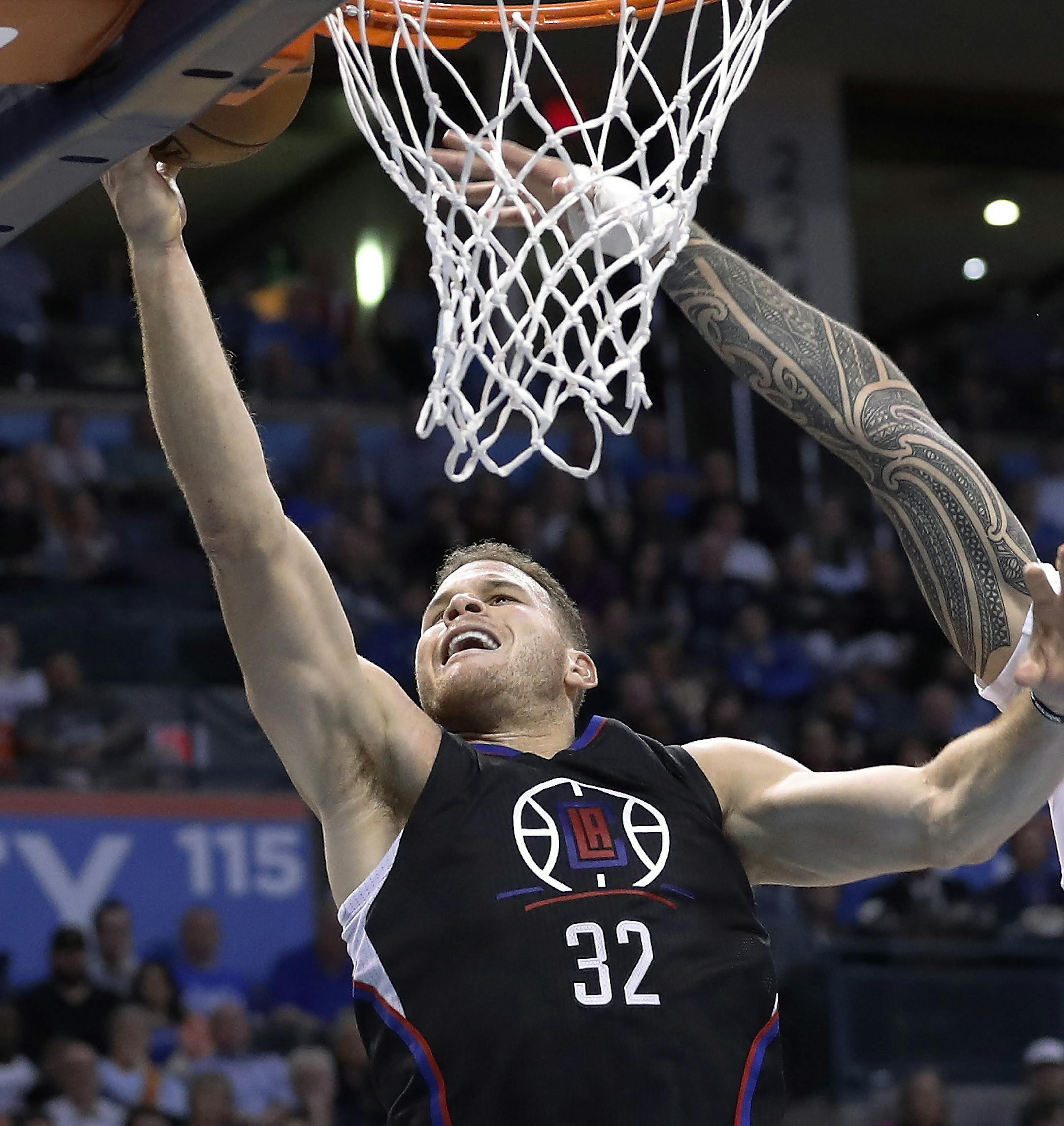Los Angeles Clippers forward Blake Griffin (32) goes up for a basket as Oklahoma City Thunder center Steven Adams (12) defends during the first half of an NBA basketball game in Oklahoma City, Friday, Nov. 11, 2016. (AP Photo/Alonzo Adams)