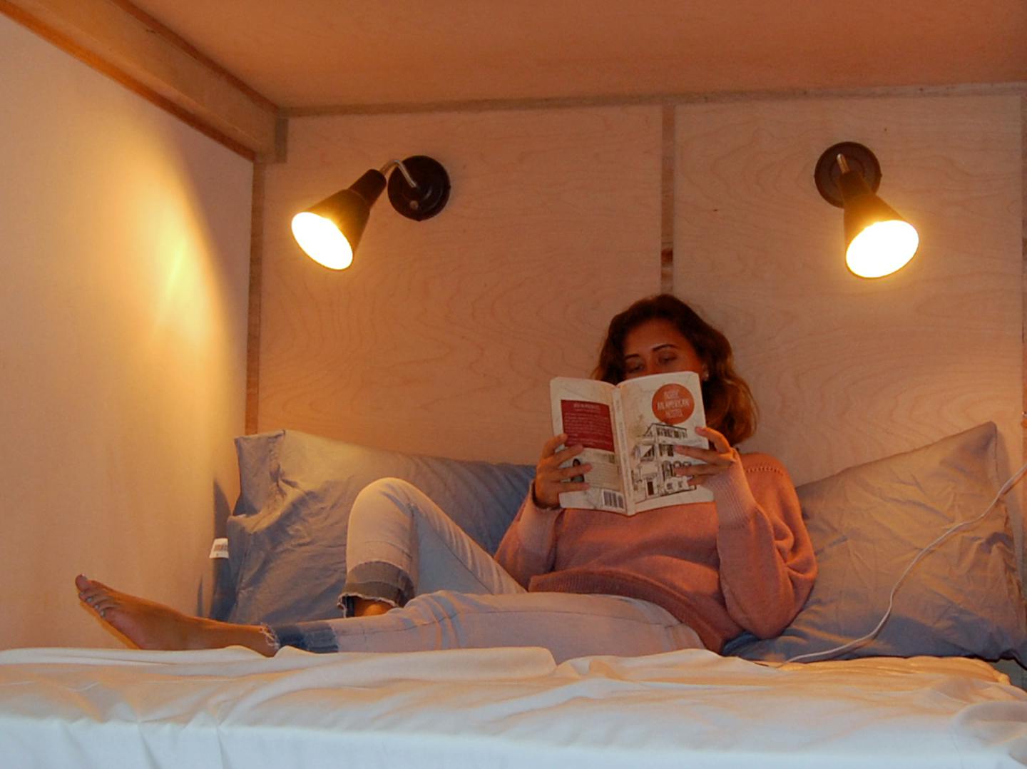 Hostel du Nord assistant manager Marguerite Bennett sits in a double-bunk bed at the hostel, set to open later this month.