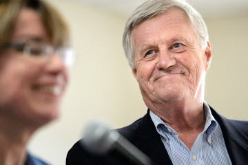 Rep. Collin Peterson smiled as Senator Amy Klobuchar praised his leadership on the farm bill.