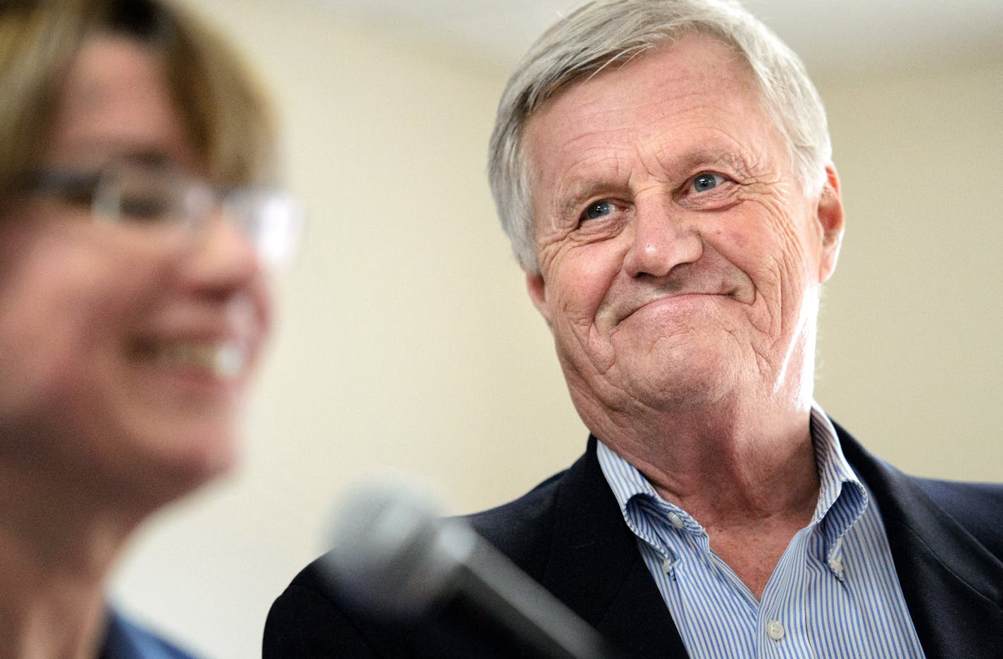 Rep. Collin Peterson smiled as Senator Amy Klobuchar praised his leadership on the farm bill.