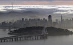 A blanket of fog covers the San Francisco skyline in a view from the Berkeley Hills Sunday, Feb. 28, 2016, in Berkeley, Calif. (AP Photo/Marcio Jose S