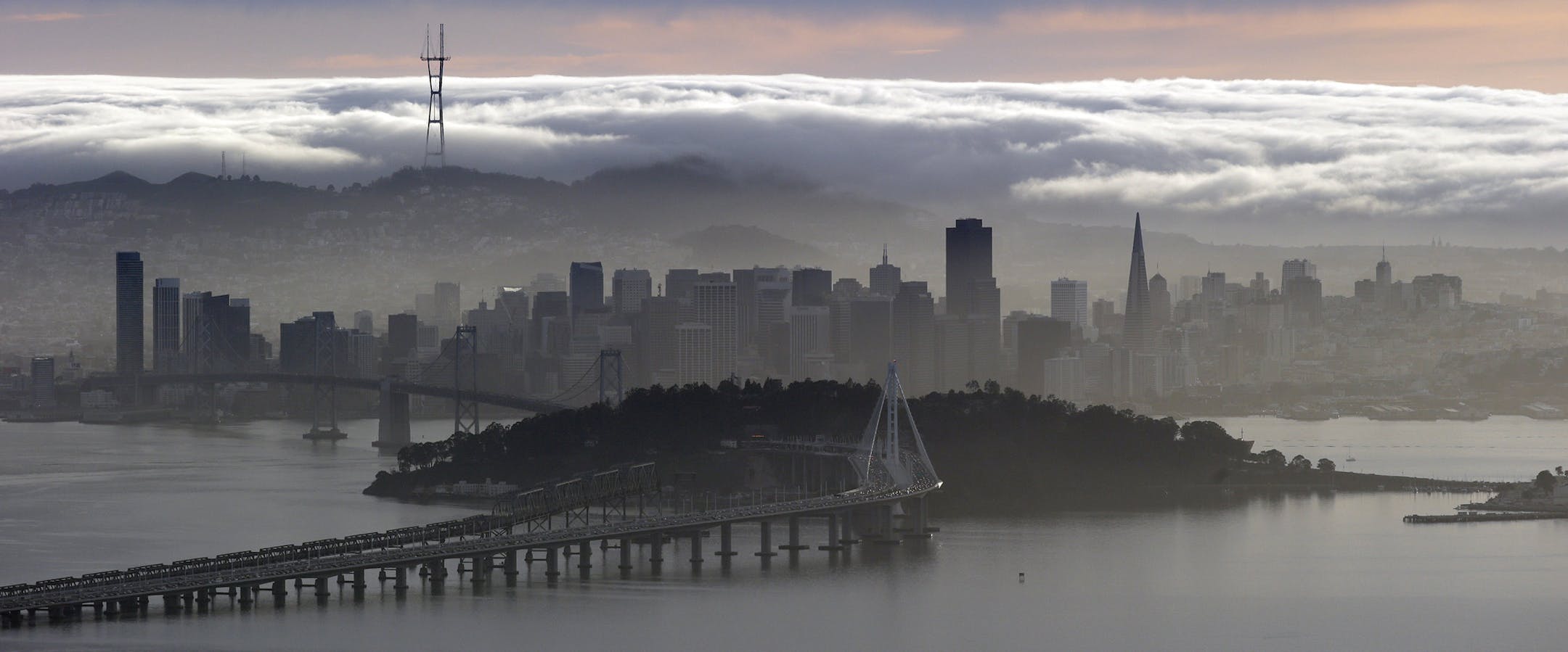 A blanket of fog covers the San Francisco skyline in a view from the Berkeley Hills Sunday, Feb. 28, 2016, in Berkeley, Calif. (AP Photo/Marcio Jose Sanchez)