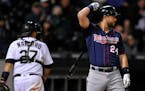 Minnesota Twins' Trevor Plouffe, 24, reacts after striking out during the eighth inning of a baseball game against the Chicago White Sox, Saturday, Ma