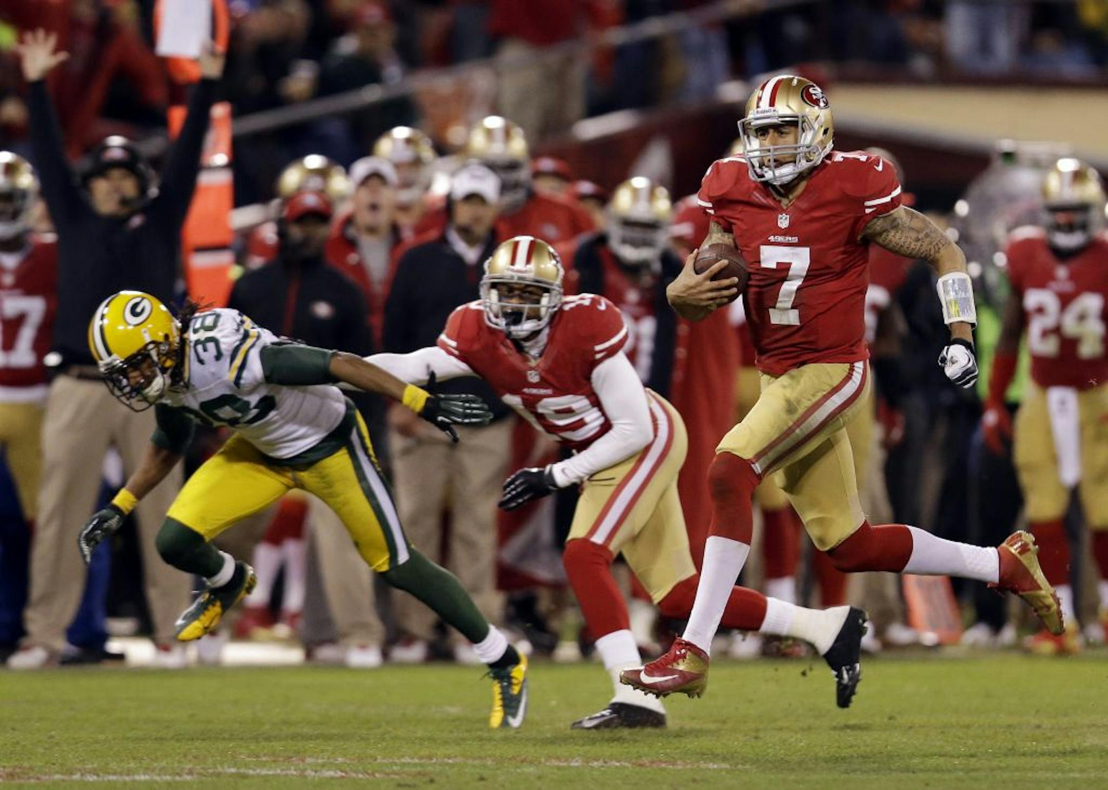 San Francisco 49ers quarterback Colin Kaepernick (7) runs for a 56-yard touchdown against the Green Bay Packers during the third quarter of an NFC divisional playoff NFL football game in San Francisco, Saturday, Jan. 12, 2013.