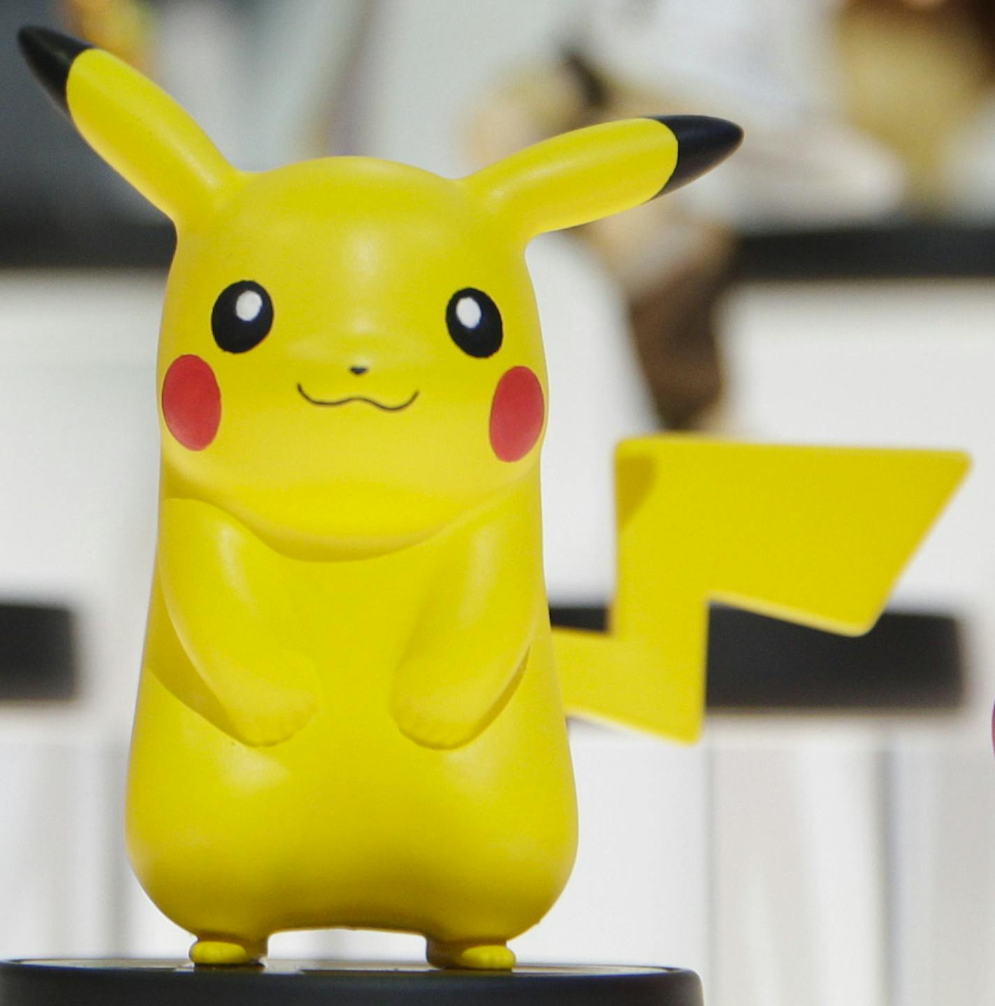 In this June 10, 2014 file photo, amiibo characters for Wii U are on display at the Nintendo booth during the Electronic Entertainment Expo, in Los Angeles. Pikachu and Link will be among the first characters coming to "amiibo." Nintendo announced the 12 characters on Friday, Aug. 29, 2014, that will be part of its upcoming toys-meet-game franchise set for release later this year. (AP Photo/Jae C. Hong, File) ORG XMIT: CAET569