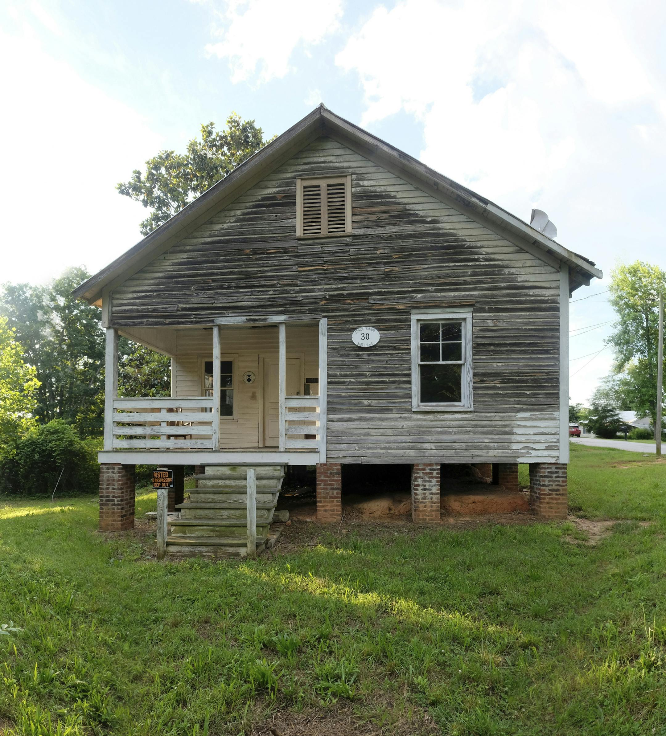 This undated handout photo made available by Nancy Pierce shows the birthplace of jazz singer Nina Simone in Tryon, NC. The dilapidated wooden cottage in North Carolina that was the birthplace of singer and civil rights activist Nina Simone now has the protection of the National Trust for Historic Preservation. The trust said in a news release Tuesday, June 19, 2018, that it will develop and find a new use for the house in Tryon where Simone was born in 1933. Last year, four African-American art