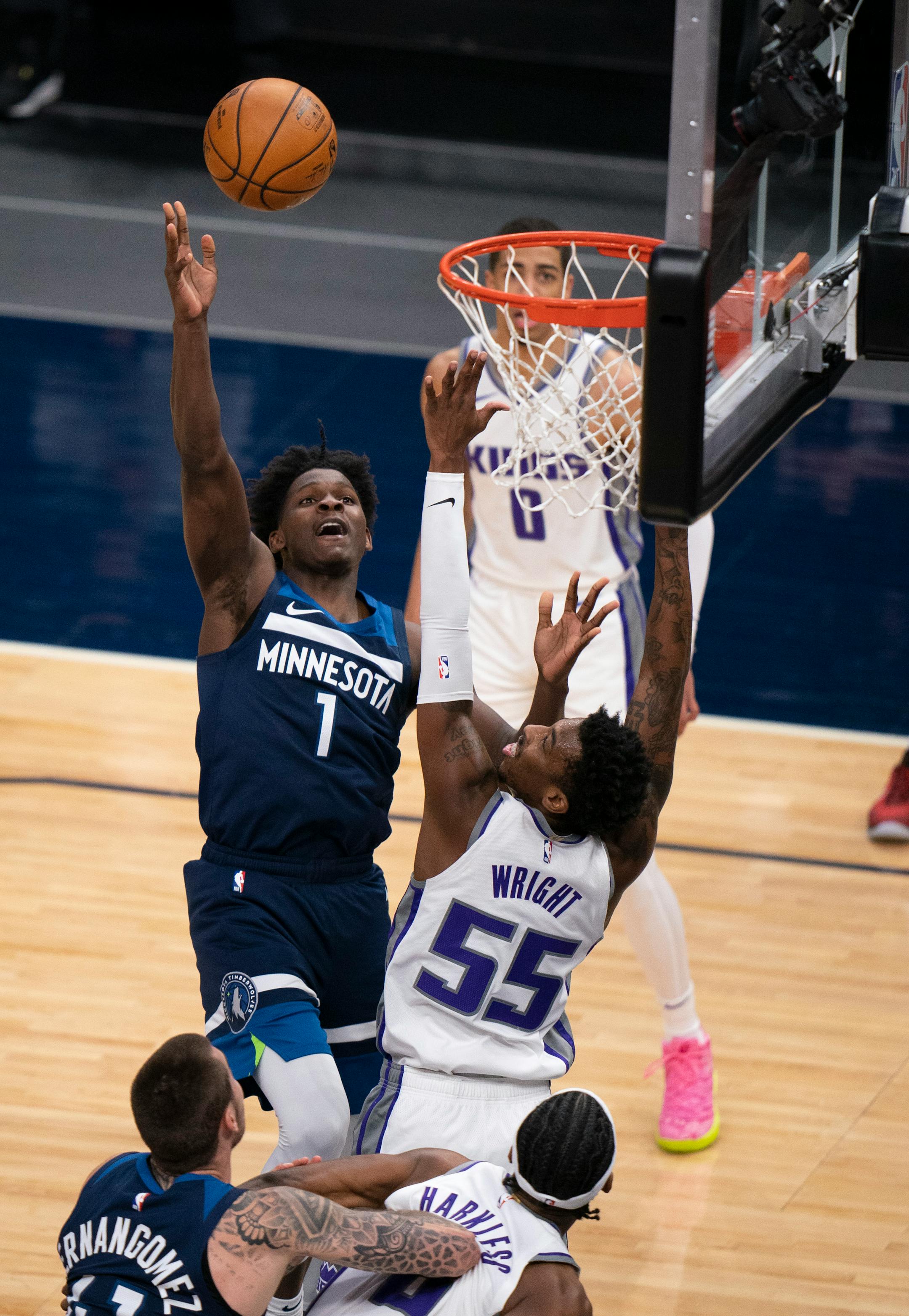 Minnesota Timberwolves forward Anthony Edwards (1) hit a basket over in the fourth quarter over Sacramento Kings guard Delon Wright (55).