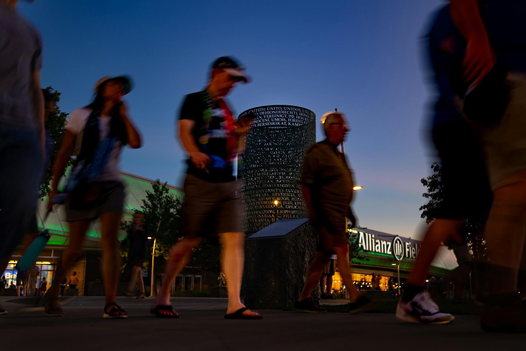 Fans file out of Allianz Stadium after a Loons win against Everton, Wednesday, July 20, 2022, St. Paul, Minn. The OMNIS sculpture by artist Jim Sanborn is located at the north side of Allianz Stadium. It is a cylindrical bronze work with text about the values of soccer written in 80 or so languages; at night, the sculpture lights up from the inside and projects text onto the ground and nearby buildings. The piece was commissioned by Bill McGuire, owner of Minnesota United and former CEO of UnitedHealthcare. ] GLEN STUBBE • glen.stubbe@startribune.com