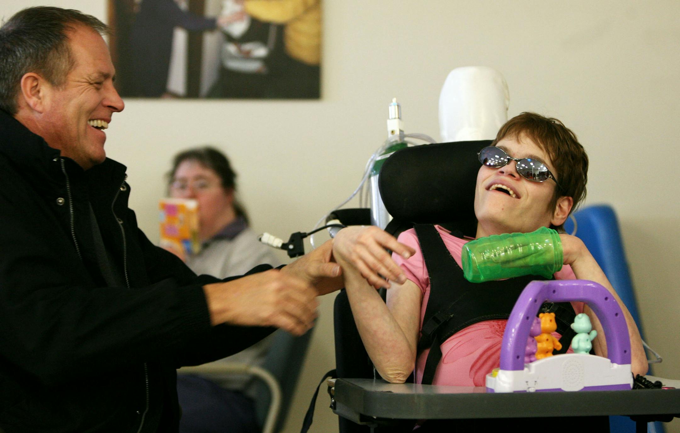 Steve Helle visited daughter Stephanie at her day program last week. Stephanie suffers from a genetic condition that has left her physically and developmentally disabled; nearly 30 years ago, doctors told Steve and his wife, Brenda Helle, that Stephanie would die before her first birthday.