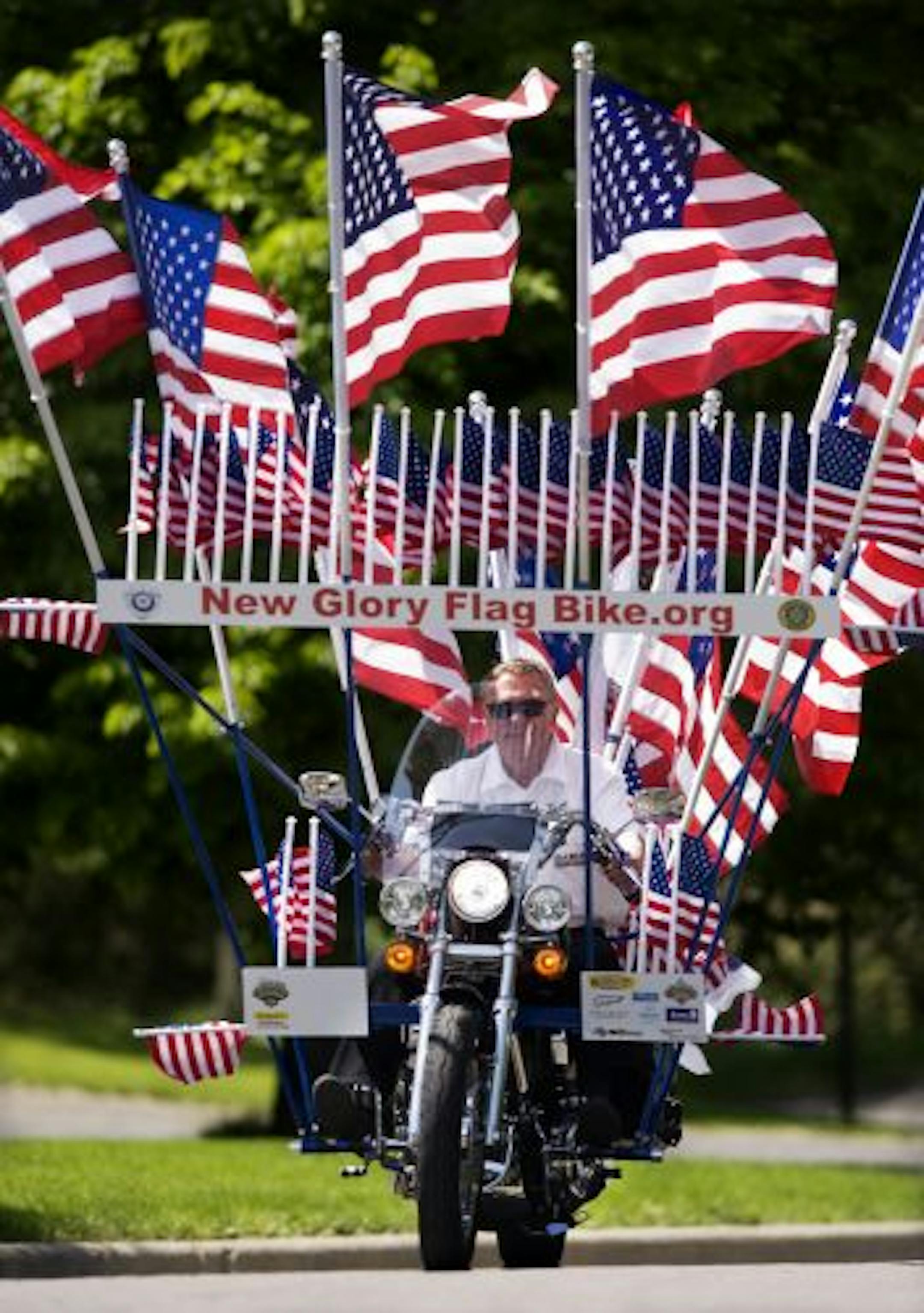 Members of the Wild Prairie Harley Owners Group created their dream bike, which sports 30,000 square inches of flags. Chris Hawver (who usually wears a helmet) showed off the New Glory Flag Bike.
