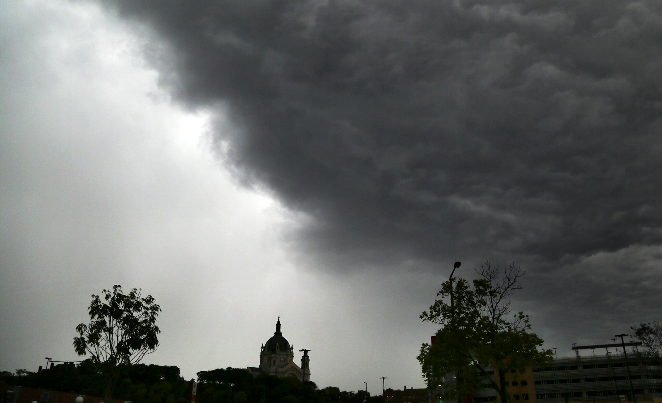 A pronounced storm front line is visible above the St. Paul Basillica Thursday, Sept. 19, 2013, in St. Paul, MN.](DAVID JOLES/STARTRIBUNE) djoles@startribune.com A line of strong storms knocked down trees and knocked out power in some areas of the Twin Cities area. ORG XMIT: MIN1309191223510175