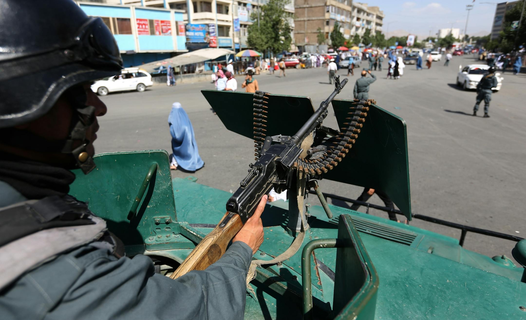 A member of the Afghan security forces stands guard during the first day of Eid Al-Fitr outside a mosque in Kabul, Afghanistan, Wednesday, July 6, 2016. The three-day holiday marks the end of the holy fasting month of Ramadan. (AP Photo/Rahmat Gul)