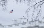 The flag above the White House is lowered to half-staff for the shooting victims of a mass shooting in a South Florida High School, Thursday, Feb. 15,